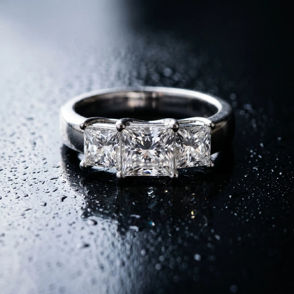 White gold Three-Stone Princess Cut Diamond Ring with Cathedral Band and Four-Prong Setting