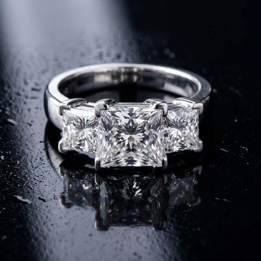 White gold Three-Stone Princess Cut Diamond Ring with Channel Set Band and Four-Prong Setting