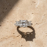 14K White Gold Three-Stone 3.03 Carat D VVS2 Princess Diamond Ring with Round Pavé Band and Prong Setting