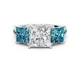 White gold Three-Stone Princess Cut Diamond Ring with Round with Blue Topaz side stone Pavé Band and Prong Setting