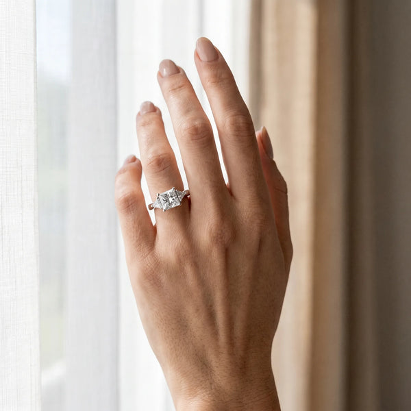 White gold Three-Stone Princess Cut Diamond Ring with Trillion Side Stones and Four-Prong Setting