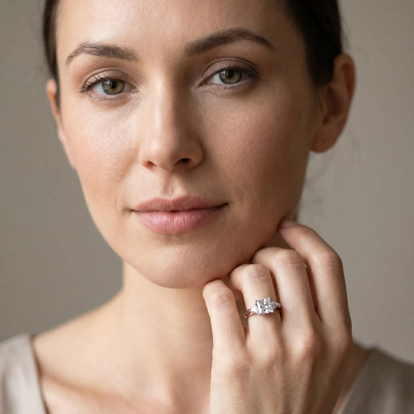 White gold Three-Stone Princess Cut Diamond Ring with Trillion Side Stones and Four-Prong Setting