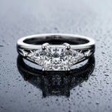 White gold Three-Stone Princess Cut Diamond Ring with Trillion Side Stones on a Split Shank Band_21