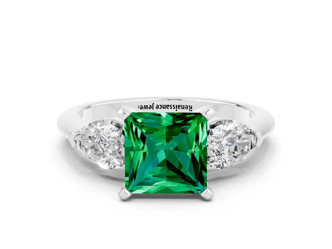 White gold Three-Stone Princess Cut Emerald Ring with Pear Side Stones and Four-Prong Setting
