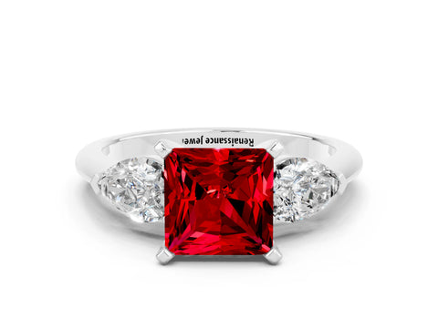 White gold Three-Stone Princess Cut Ruby Ring with Pear Side Stones and Four-Prong Setting