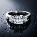 White gold Three-Stone Princess Cut Solitaire Ring with Round Side Stones and Four-Prong Setting_30