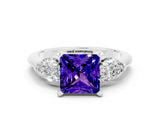 White gold Three-Stone Princess Cut Tanzanite Ring with Pear Side Stones and Four-Prong Setting