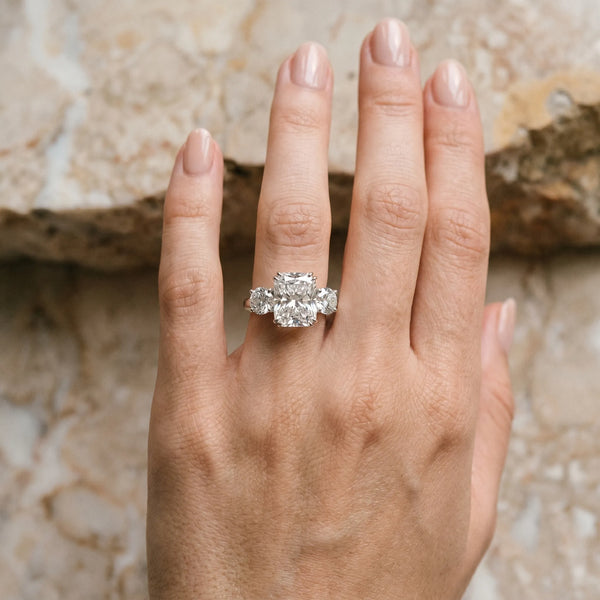 White gold Three-Stone Radiant Cut Diamond Engagement Ring with Prong Setting on a White Gold Band