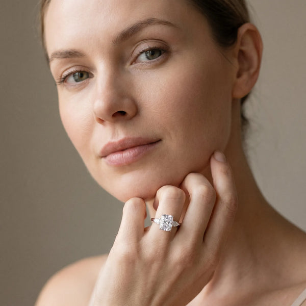 White gold Three-Stone Radiant Cut Diamond Ring with Pear Side Stones in Four-Prong Setting