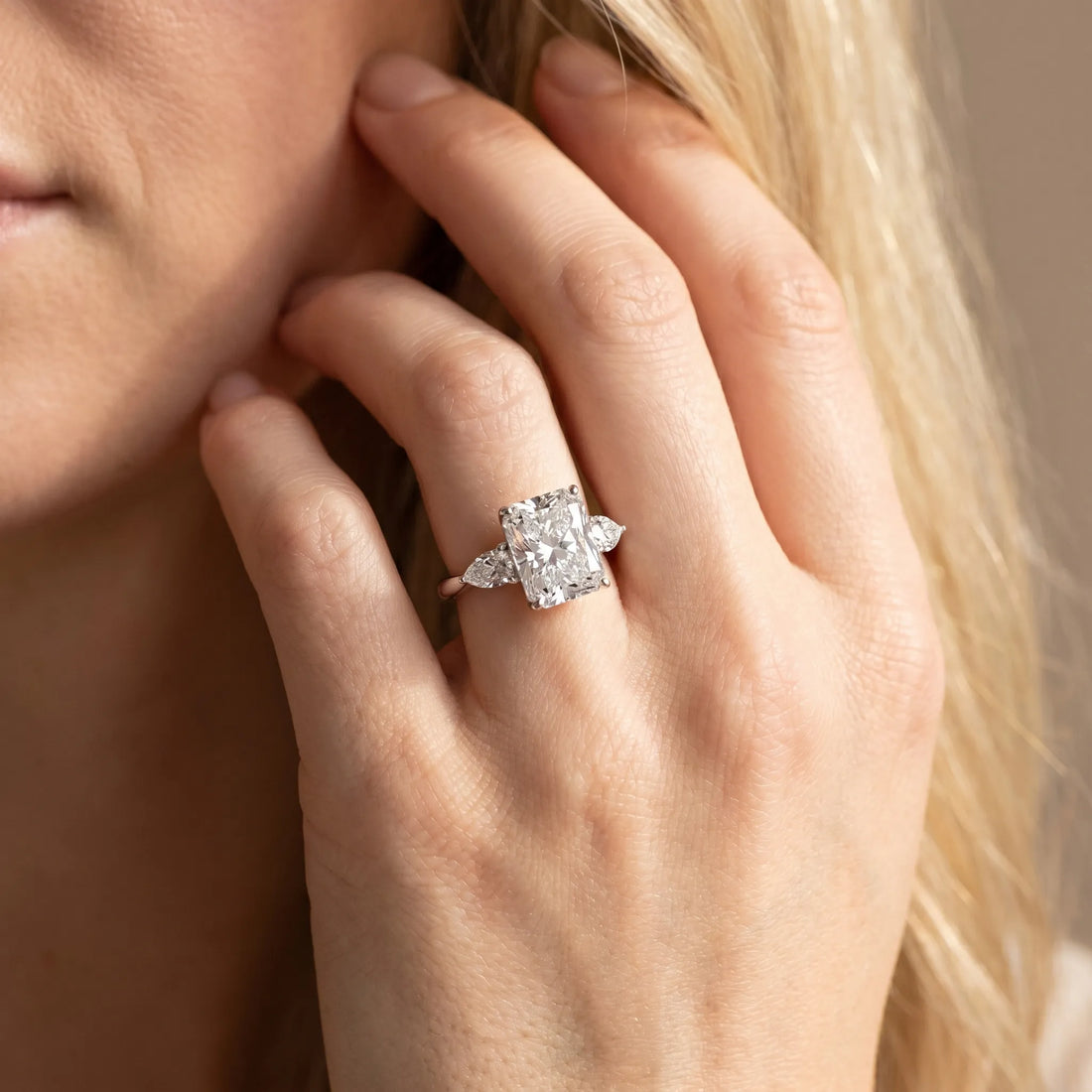 White gold Three-Stone Radiant Cut Diamond Ring with Pear Side Stones in Four-Prong Setting_190