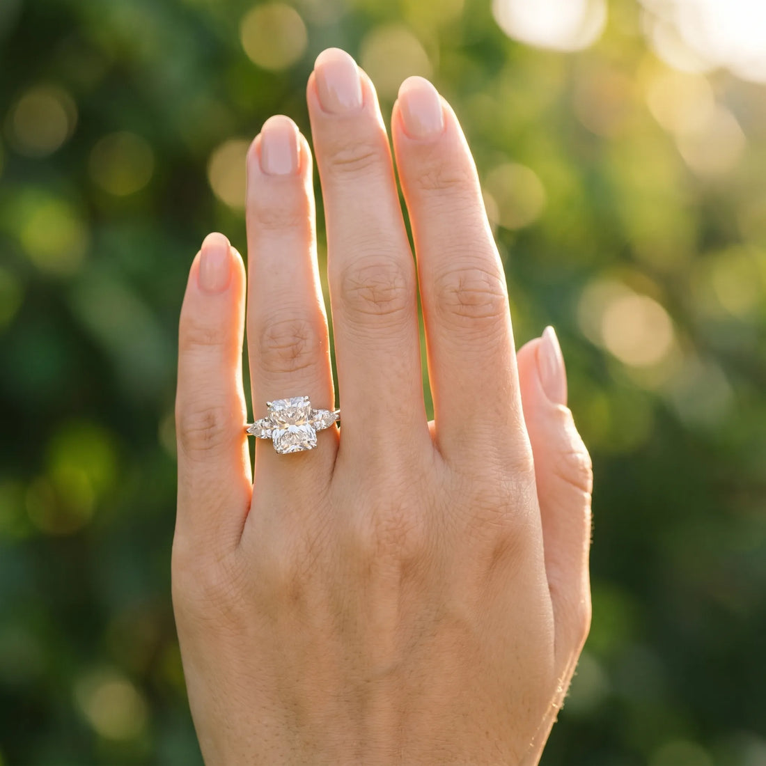 White gold Three-Stone Radiant Cut Diamond Ring with Pear Side Stones in Four-Prong Setting_210