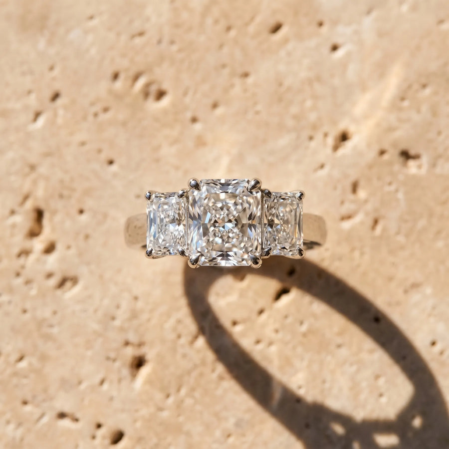 White gold Three-Stone Radiant Cut Diamond Ring with Prong Setting and Classic Band