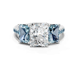 White gold Three-Stone Radiant Cut Diamond Ring with Round with Aquamarine side stone Pavé Band and Prong Setting