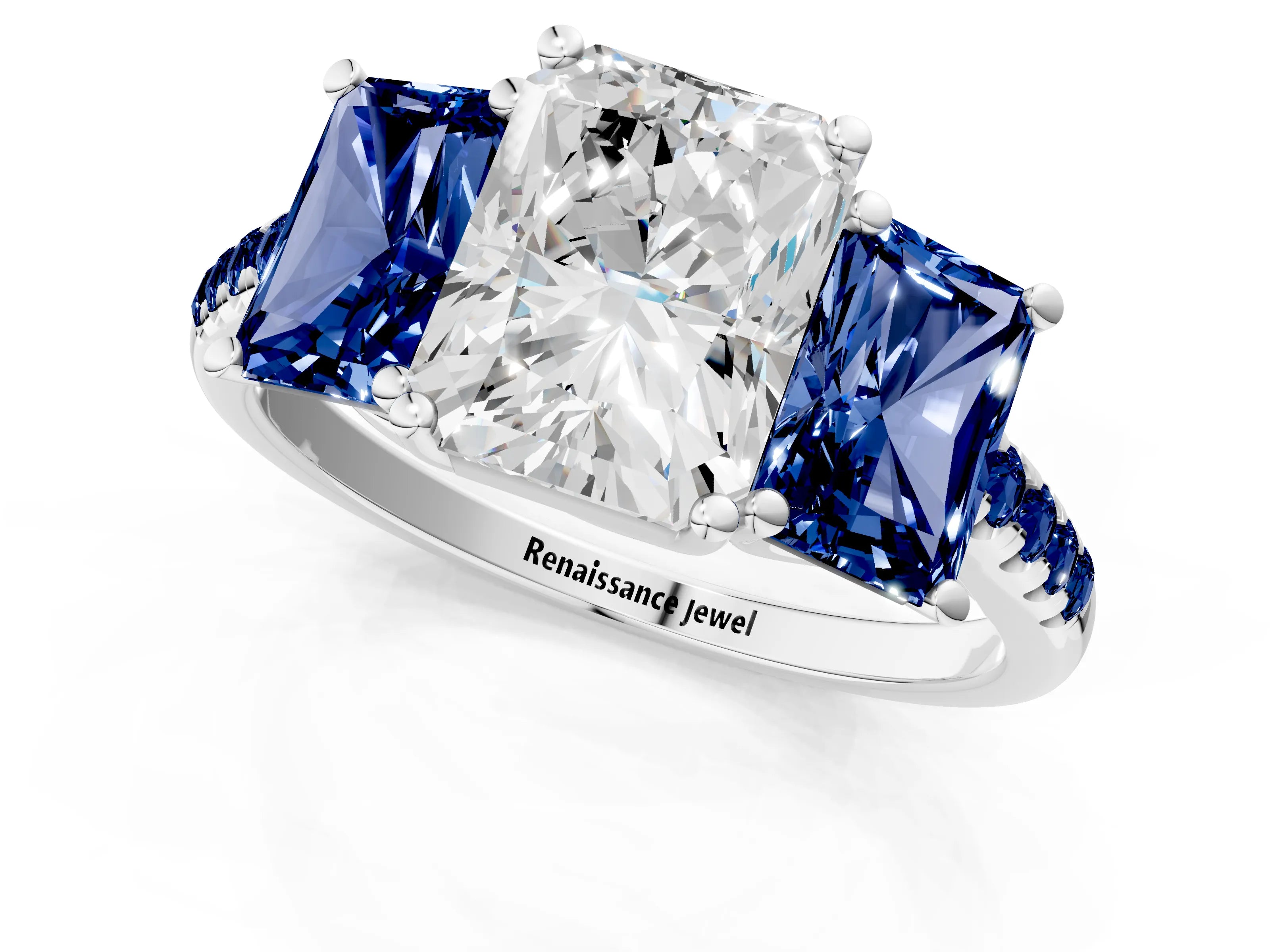 White gold Three-Stone Radiant Cut Diamond Ring with Round with Blue Sapphire side stone Pavé Band and Prong Setting_1