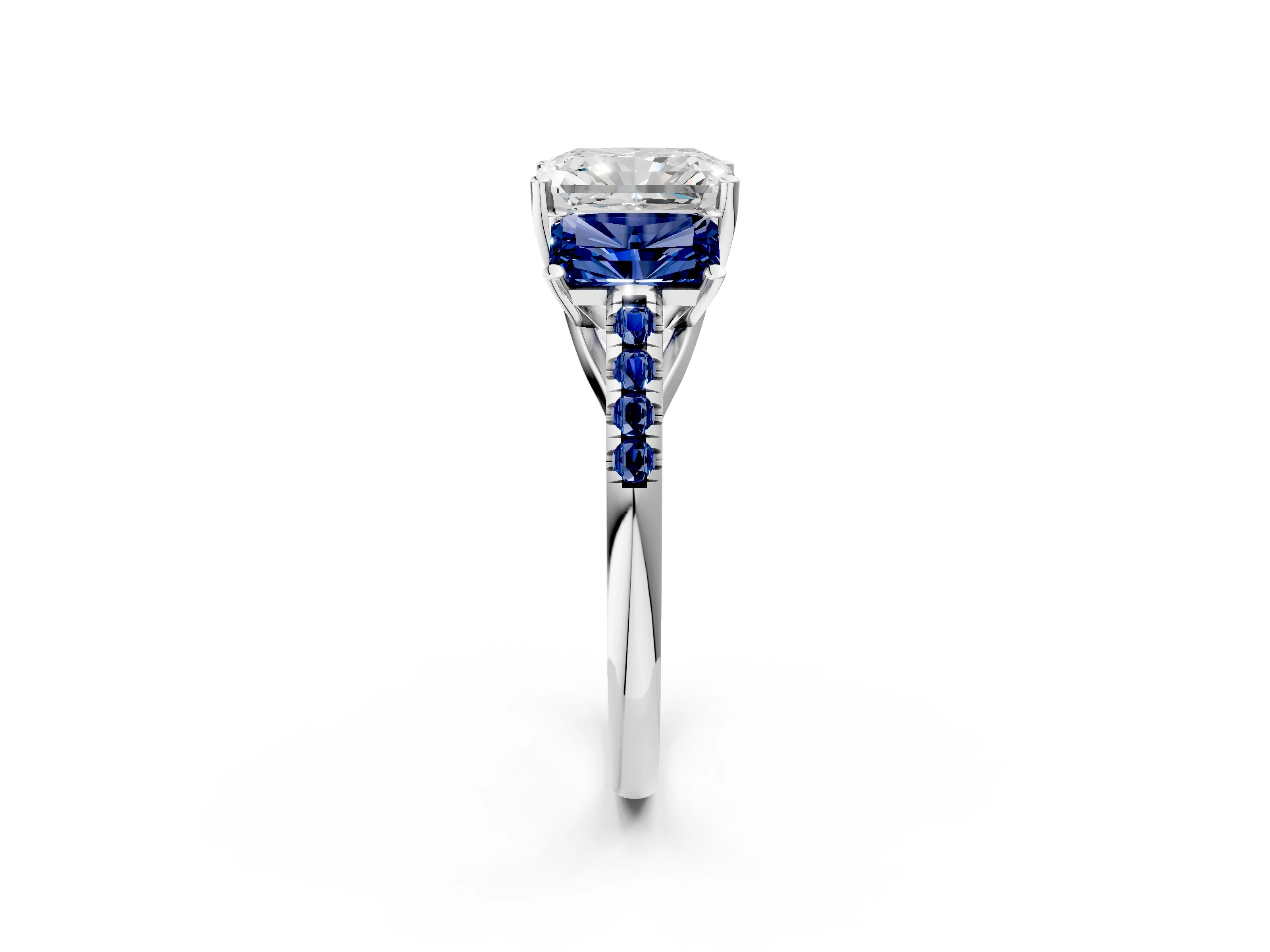 White gold Three-Stone Radiant Cut Diamond Ring with Round with Blue Sapphire side stone Pavé Band and Prong Setting_2