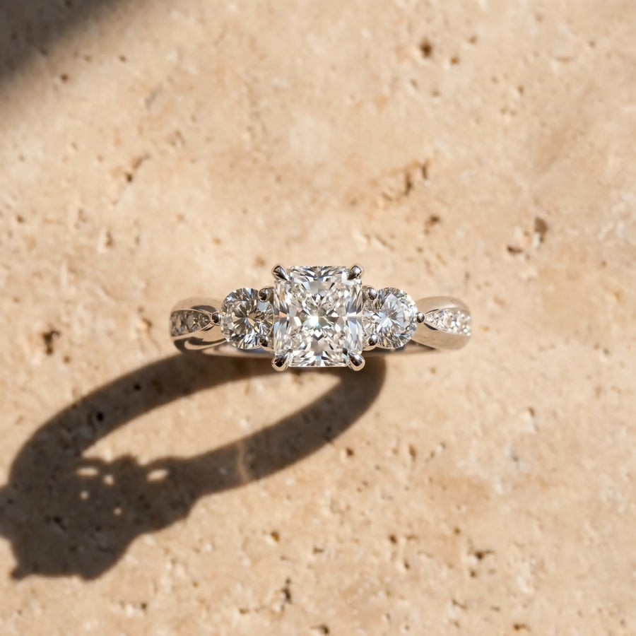 White gold Three-Stone Radiant Diamond Channel Set Engagement Ring with Prong Setting