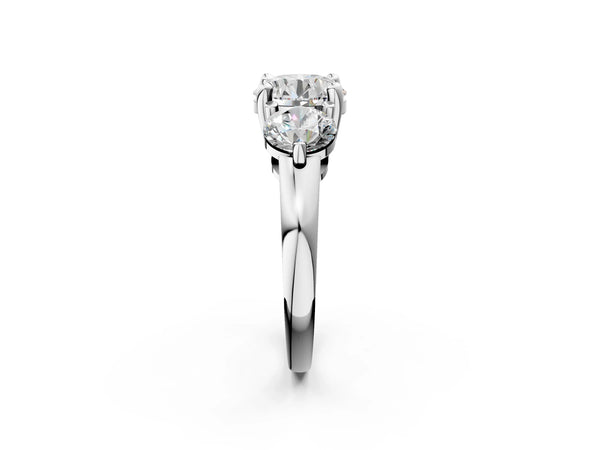 White gold Three-Stone Round Brilliant Cut Solitaire Ring with Prong Setting on a Classic Band