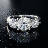 White gold Three-Stone Round Brilliant Cut Solitaire Ring with Prong Setting on a Classic Band_69