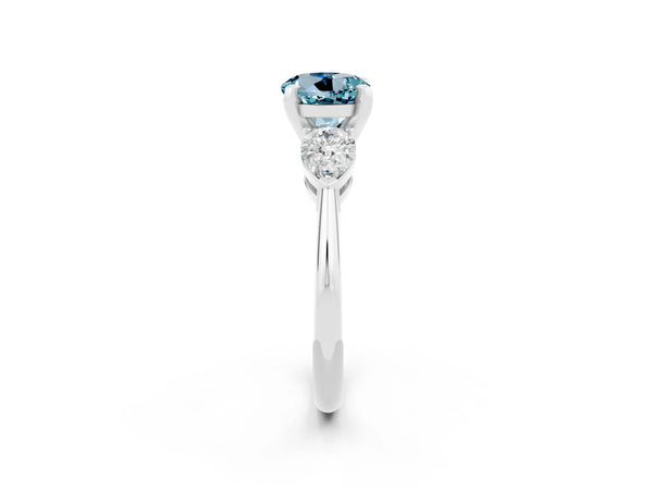 Silver Three-Stone Round Cut Aquamarine Ring with Pear Side Stones and Four-Prong Setting