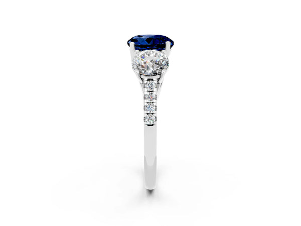 Silver Three-Stone Round Cut Blue Sapphire Ring with Round  Pavé Band and Prong Setting