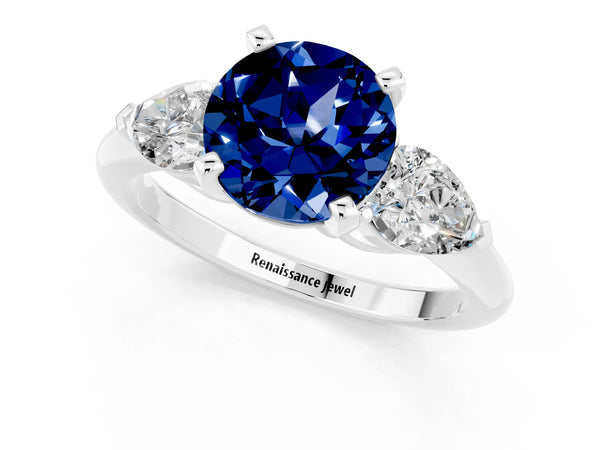 Platinum Three-Stone Round Cut Blue Sapphire Ring with Pear Side Stones and Four-Prong Setting