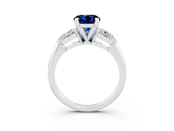 Silver Three-Stone Round Cut Blue Sapphire Ring with Pear Side Stones and Four-Prong Setting