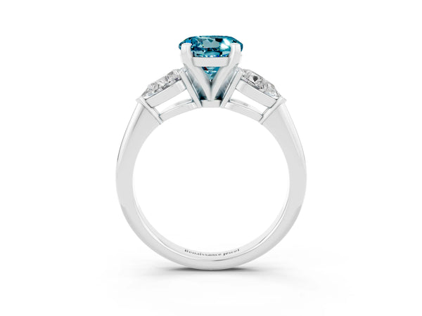 Silver Three-Stone Round Cut Blue Topaz Ring with Pear Side Stones and Four-Prong Setting
