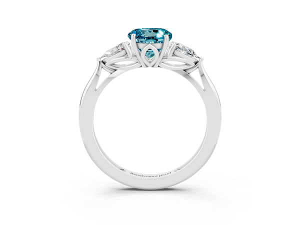 Platinum Three-Stone Round Cut Blue Topaz Ring with Pear  Side Stones in Four-Prong Setting