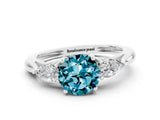 White gold Three-Stone Round Cut Blue Topaz Ring with Pear  Side Stones in Four-Prong Setting_48