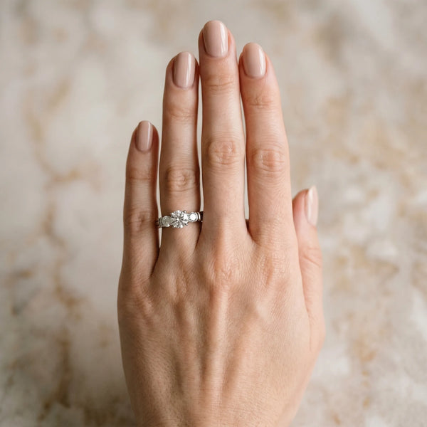 White gold Three-Stone Round Cut Channel Set Diamond Ring with Four-Prong Setting