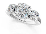 14K White Gold Three-Stone 3.09 Carat D VVS1 Round Cut Diamond Ring with Channel Set Band and Four-Prong Setting