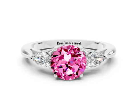 White gold Three-Stone Round Cut Cut Diamond Ring with Pear Side Stones in Four-Prong Setting