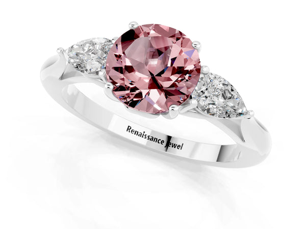 Platinum Three-Stone Round Cut Cut Diamond Ring with Pear Side Stones in Four-Prong Setting