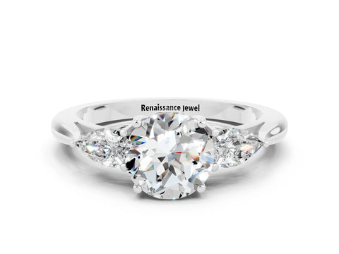 White gold Three-Stone Round Cut Cut Diamond Ring with Pear Side Stones in Four-Prong Setting