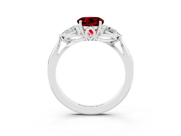 Platinum Three-Stone Round Cut Cut Diamond Ring with Pear Side Stones in Four-Prong Setting