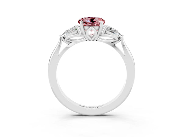 Platinum Three-Stone Round Cut Cut Diamond Ring with Pear Side Stones in Four-Prong Setting