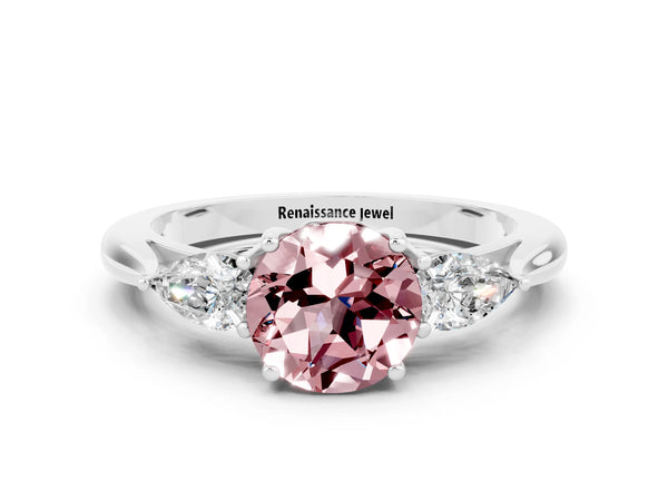 Platinum Three-Stone Round Cut Cut Diamond Ring with Pear Side Stones in Four-Prong Setting