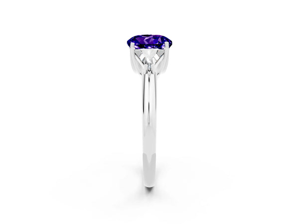 White gold Three-Stone Round Cut Tanzanite Engagement Ring with Trillion Side Stones and Prong Setting