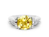White gold Three-Stone Round Cut Cut Diamond Ring with Trillion Side Stones and Four-Prong Setting