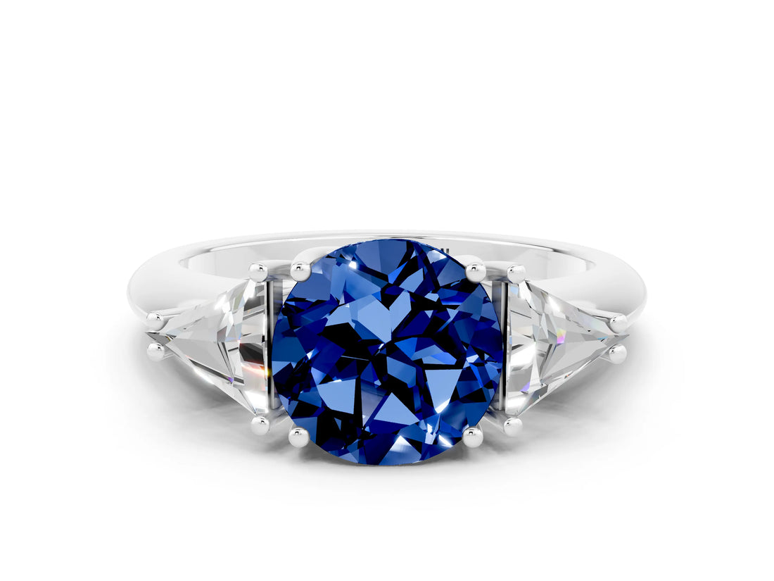 White gold Three-Stone Round Cut Cut Diamond Ring with Trillion Side Stones and Four-Prong Setting