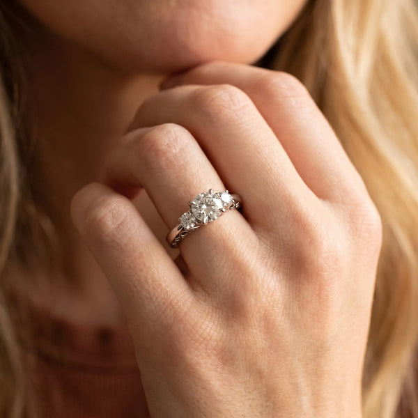 White gold Three-Stone Round Cut Diamond Cathedral Engagement Ring with Prong Setting