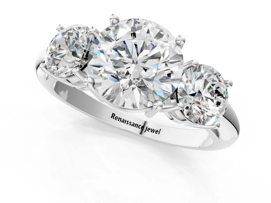 White gold Three-Stone Round Cut Diamond Engagement Ring with Prong Setting on a White Gold Band