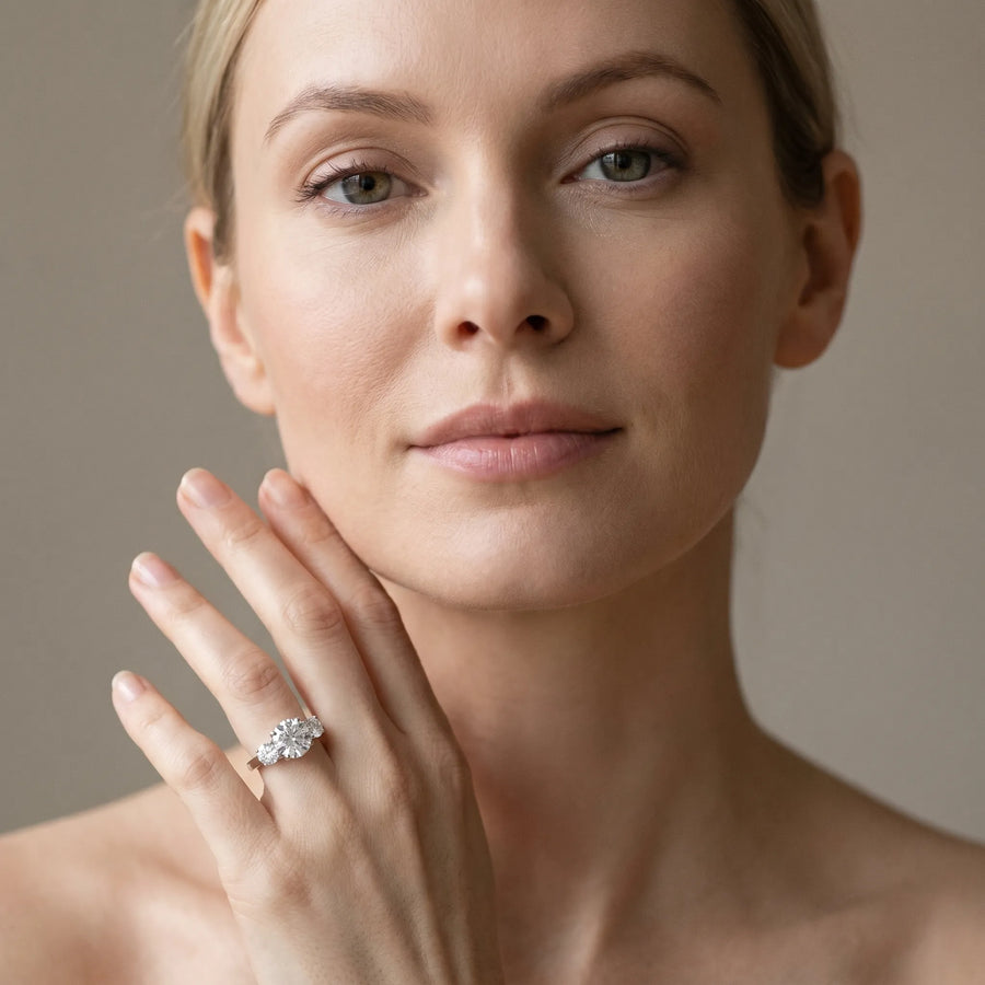 White gold Three-Stone Round Cut Diamond Engagement Ring with Prong Setting on a White Gold Band