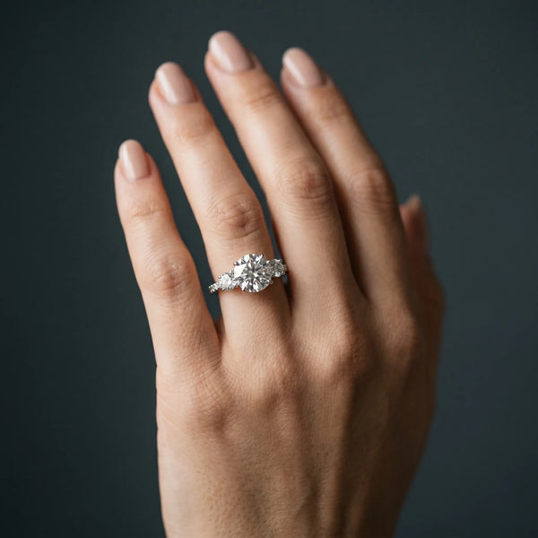 White gold Three-Stone Round Cut Diamond Pavé Band with Prong Setting