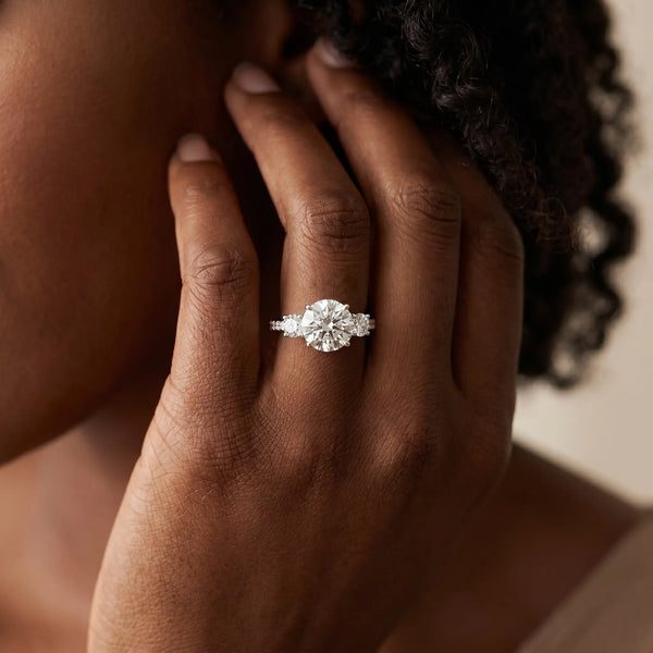 White gold Three-Stone Round Cut Diamond Pavé Band with Prong Setting
