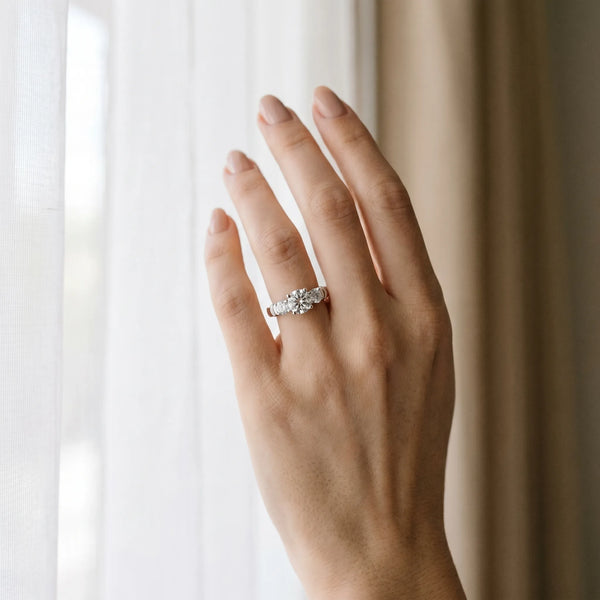 White gold Three-Stone Round Cut Diamond Ring with Channel Band and Prong Setting