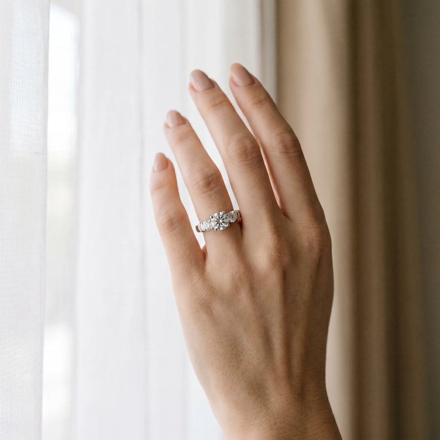 White gold Three-Stone Round Cut Diamond Ring with Channel Band and Prong Setting