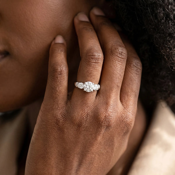 White gold Three-Stone Round Cut Diamond Ring with Channel Band and Prong Setting