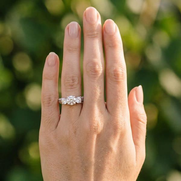 White gold Three-Stone Round Cut Diamond Ring with Channel-Set Band and Prong Setting