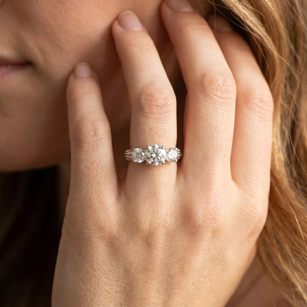 White gold Three-Stone Round Cut Diamond Ring with Channel-Set Band and Prong Setting